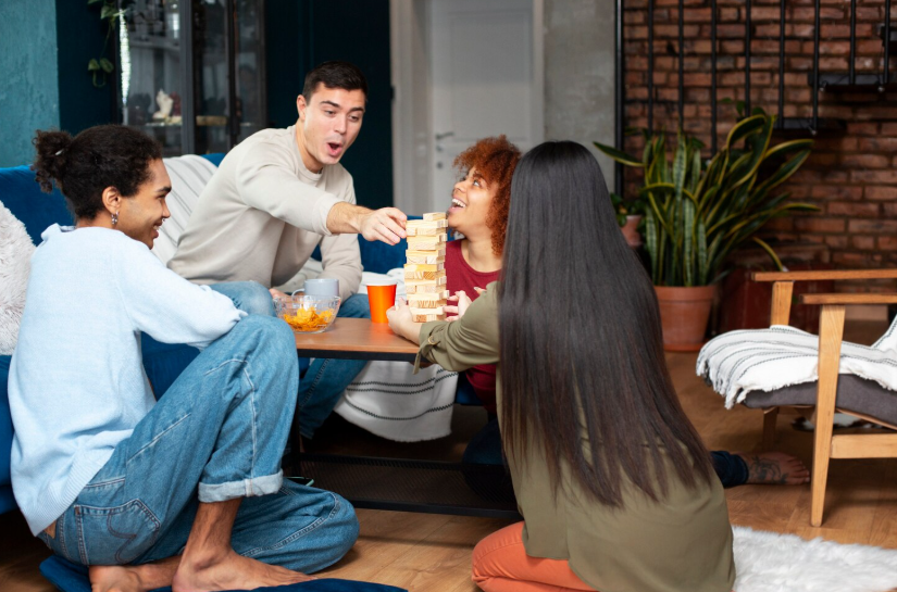 Zero-spend weekend with friends enjoying free game night at home instead of paid entertainment.