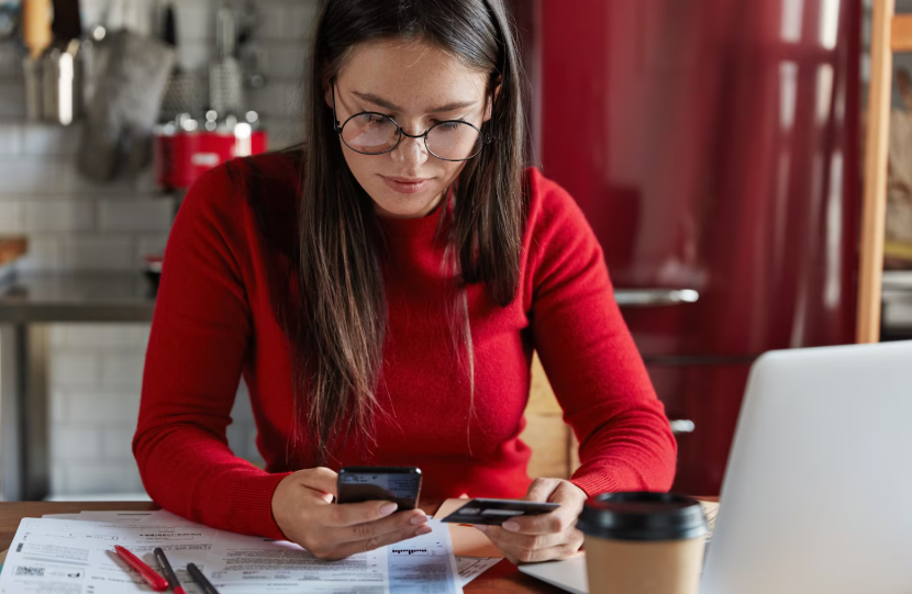 Hidden fees to avoid in 2026 as a shopper reviews bills, receipts, and credit card charges for unnecessary add-ons.